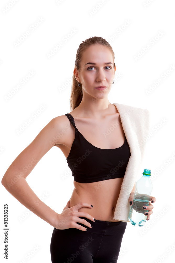 Slim sport girl with bottle of water and towel Slim sport girl with bottle of water and towel
