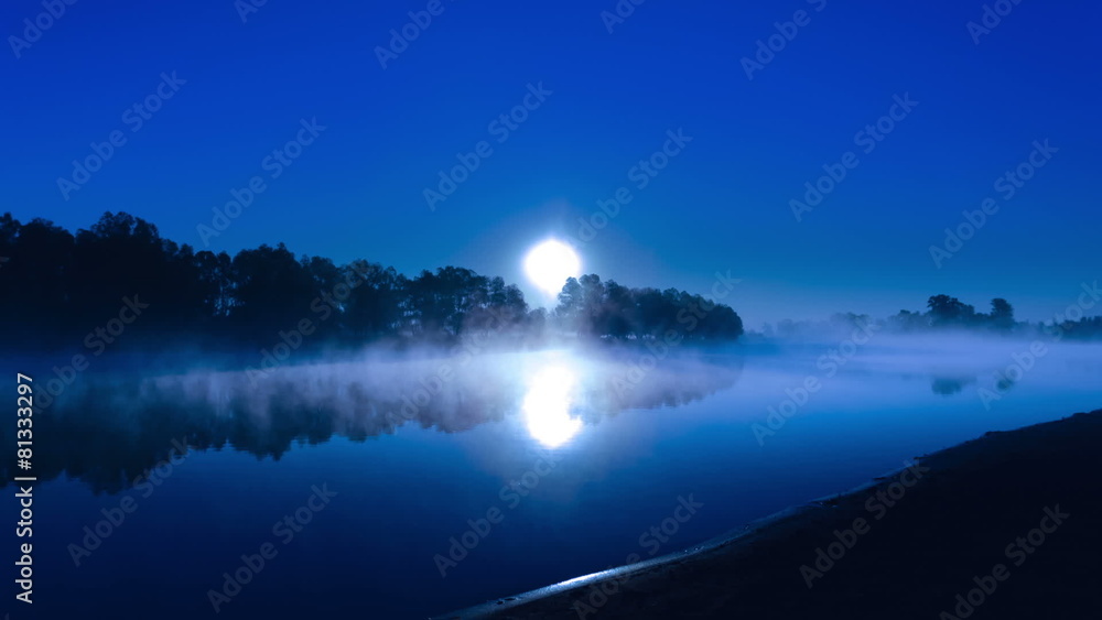 The moon above the forest and lake The moon above the forest and lake