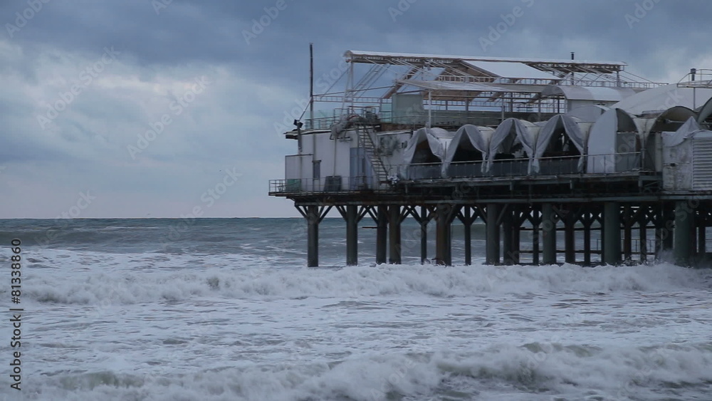 The restaurant building in the Black sea during a storm in Sochi The restaurant building in the Black sea during a storm in Sochi