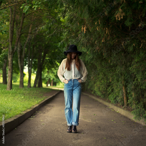 girl in a hat walks in the park © VectorART