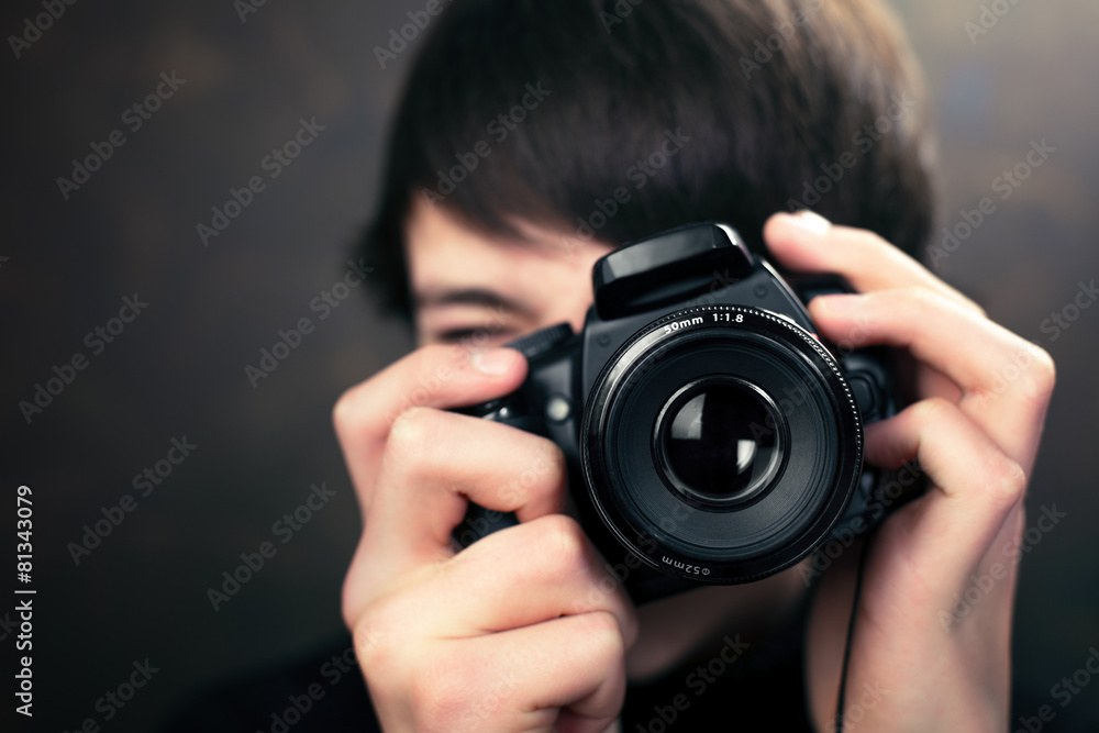 Teenager with digital compact camera Teenager with digital compact camera
