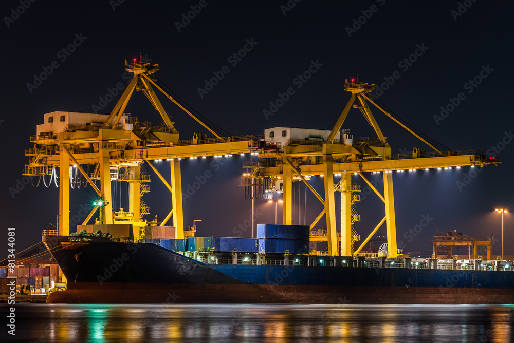 Obraz premium container cargo freight ship with working crane bridge in shipya