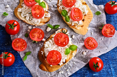 Sandwich with cheese, tomato and Basil