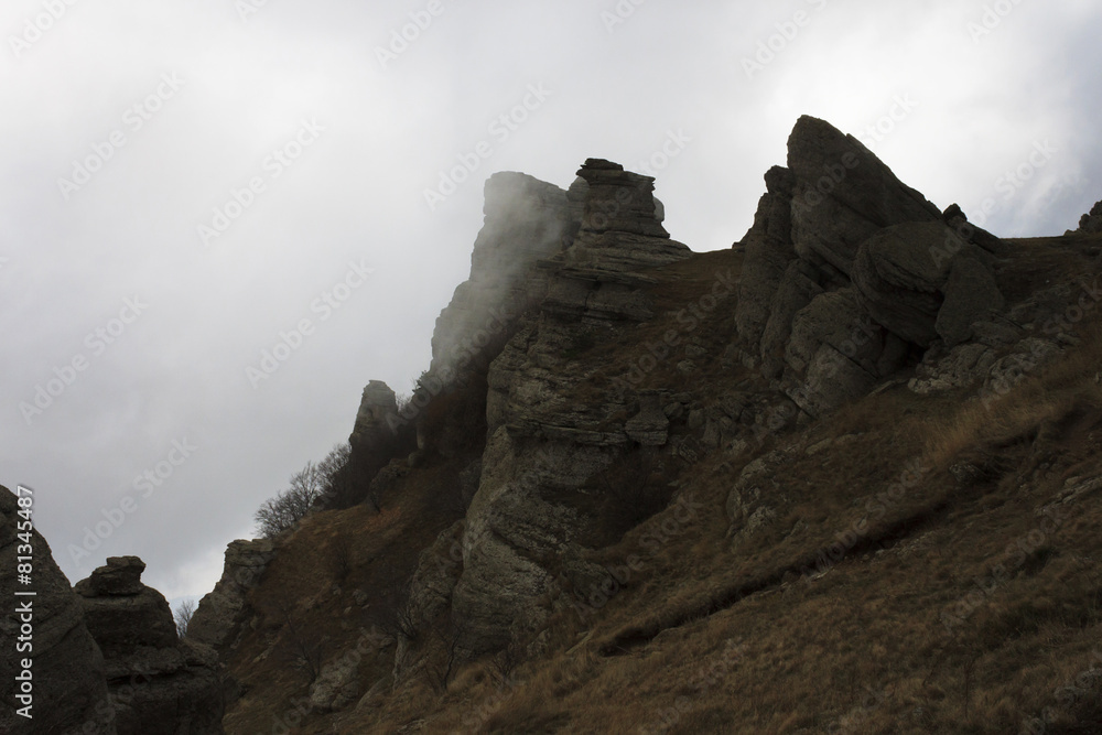 rocks on mountain in cloud