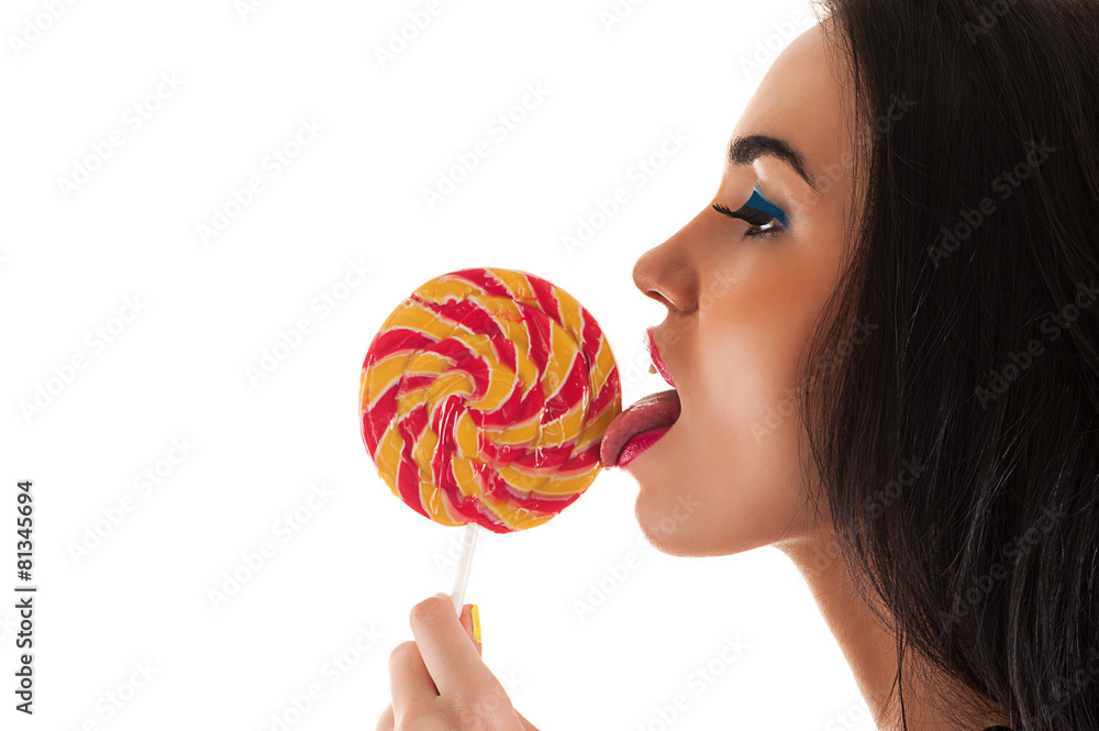 attractive woman licking a lollipop