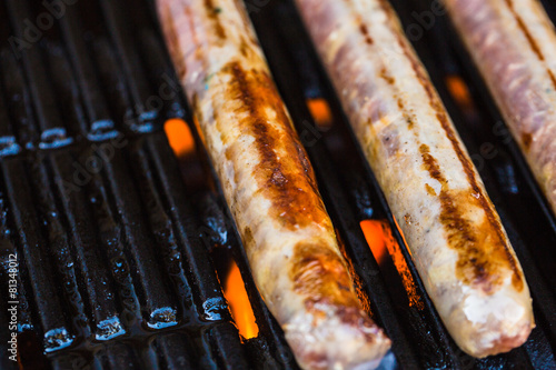 Barbecued beef sausages on grill