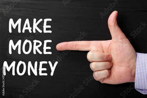 Pointing a Finger at the phrase Make More Money photo