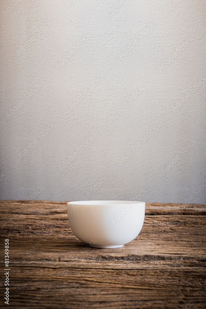 Empty little bowl on wooden tabletop Empty little bowl on wooden tabletop