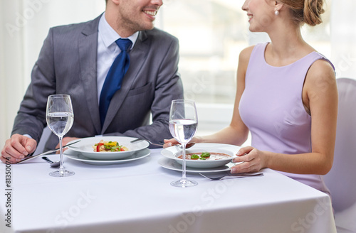 close up of couple talking at restaurant
