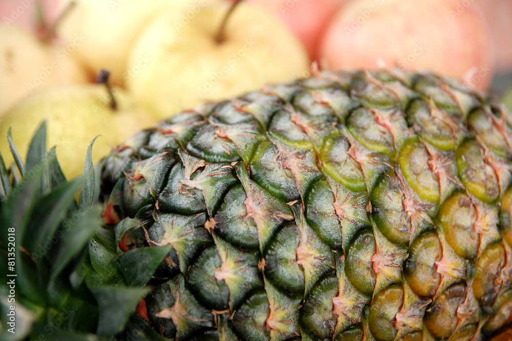 Fototapeta premium Fresh Pineapple in front of other fruit