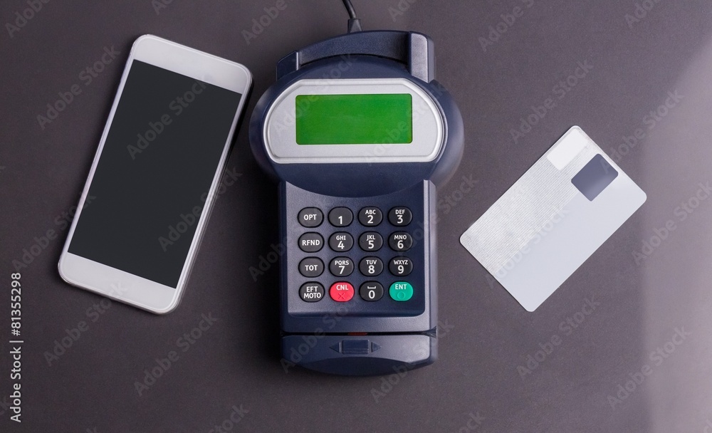Overhead of pin terminal and smartphone Overhead of pin terminal and smartphone