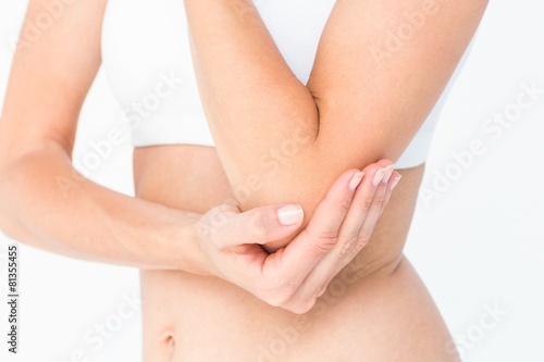 Woman suffering from elbow pain © WavebreakMediaMicro
