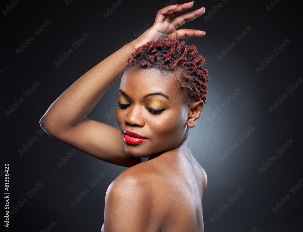 Black beauty with short spiky hair Stock Photo | Adobe Stock