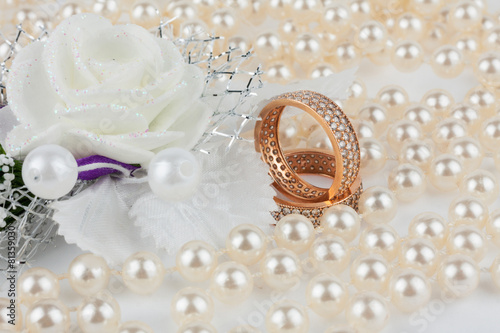 Wedding rings among the pearls with flower