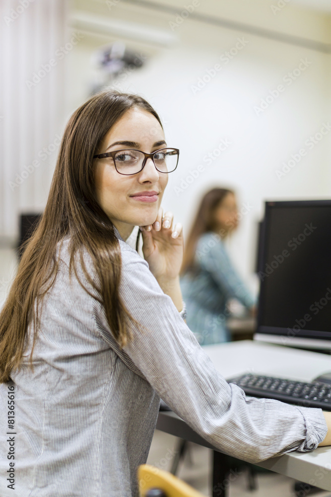 Young beautiful girl working on a computer Young beautiful girl working on a computer
