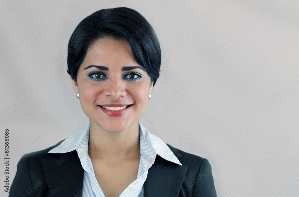 Business latin woman smiling isolated on a gray background Business latin woman smiling isolated on a gray background