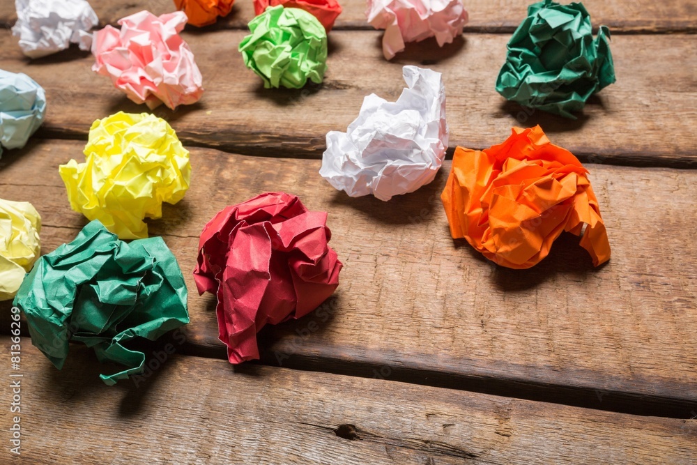 Idea. Crumpled colorful paper on wooden background creative Idea. Crumpled colorful paper on wooden background creative