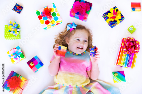 Little girl with birthday presents