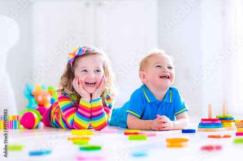 Cjildren playing with wooden toys