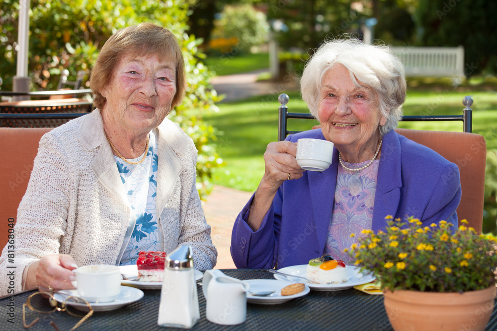 Senior Women Having Coffee at the Garden Table. Senior Women Having Coffee at the Garden Table.