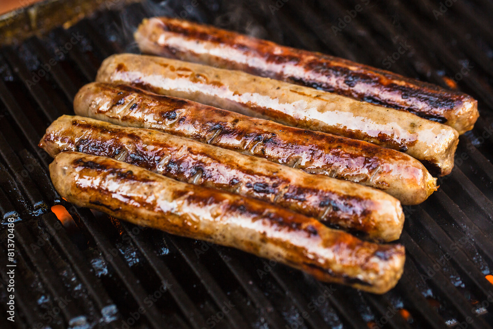Barbecued beef sausages on grill