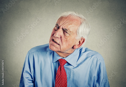 senior man hard of hearing asking to speak up can't hear photo