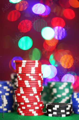 Chips for poker on shiny background