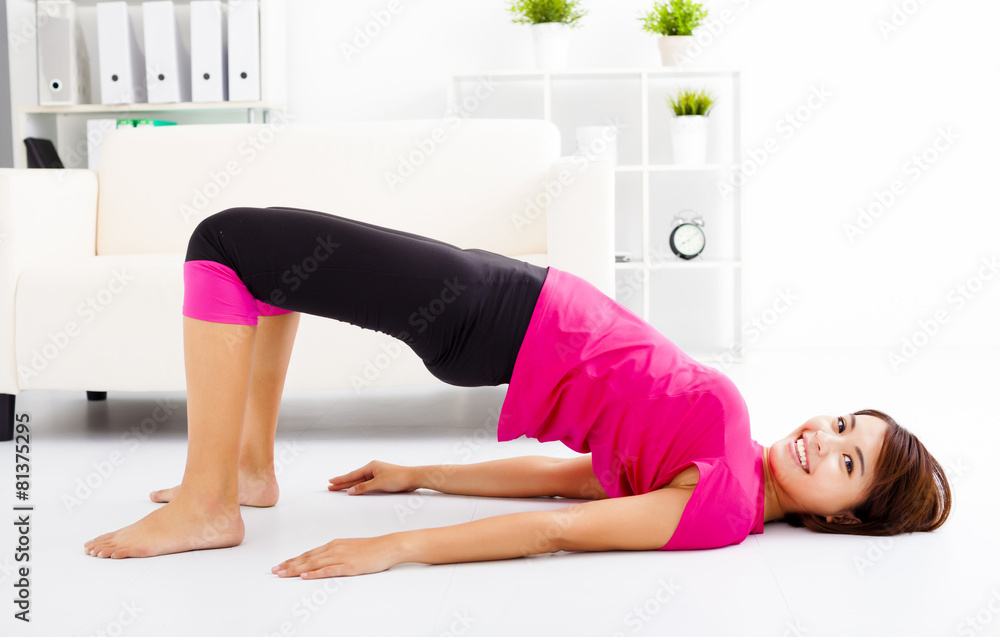 beautiful young woman stretching on the floor beautiful young woman stretching on the floor