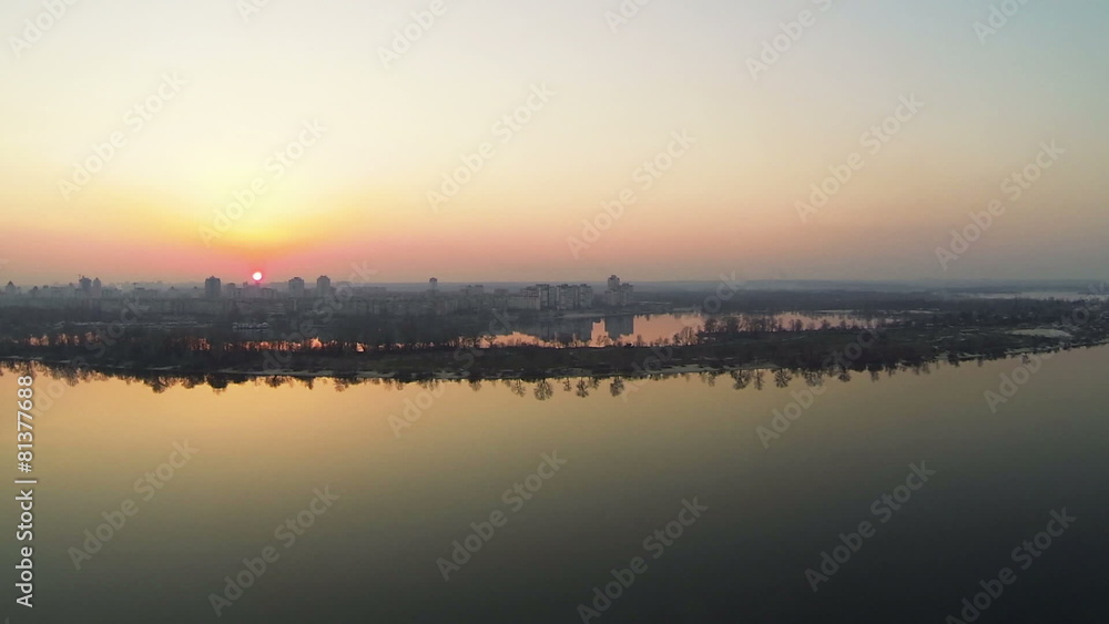 Flight over river on red sunset. Aerial panorama Flight over river on red sunset. Aerial panorama