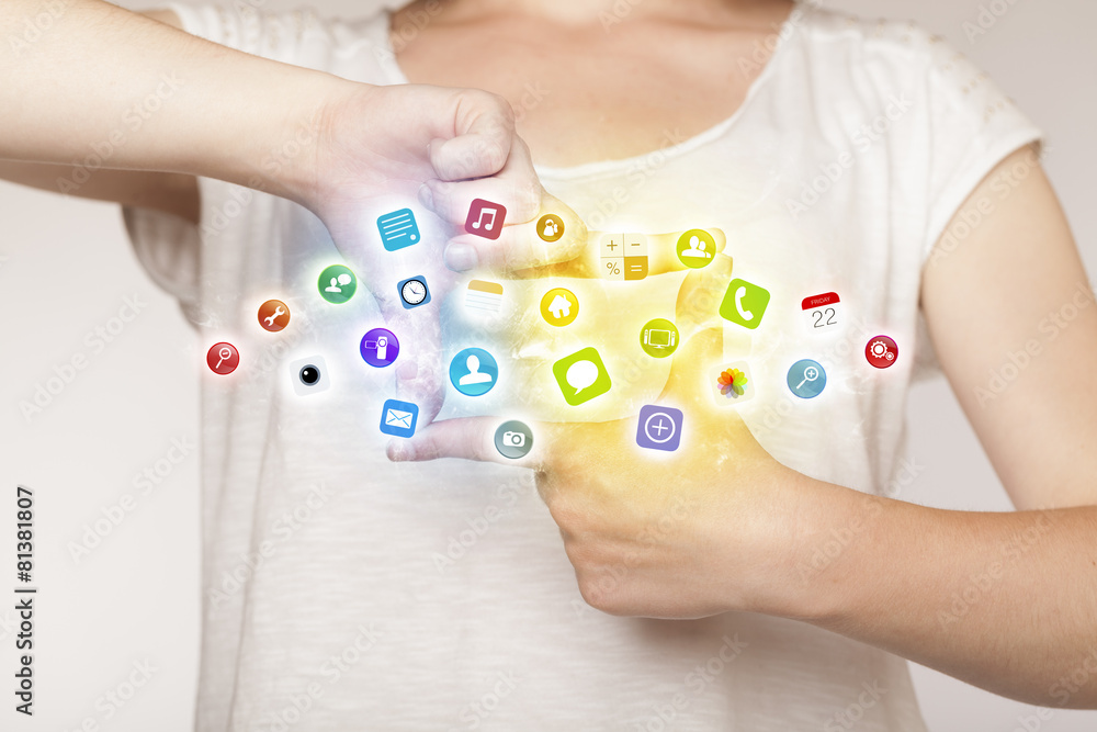 Hands creating a form with mobile app icons Hands creating a form with mobile app icons
