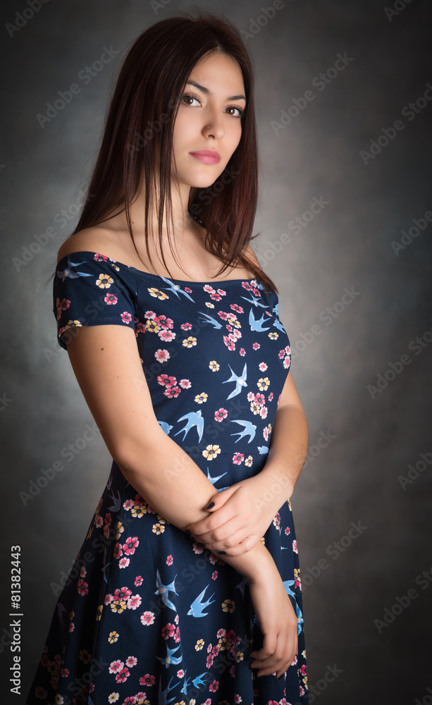 Happy beautiful woman in sundress on grey background. Happy beautiful woman in sundress on grey background.