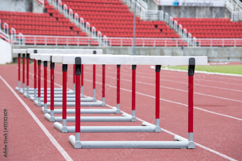 hurdles on the red running track prepared