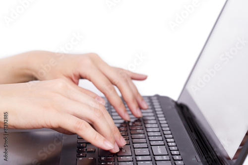 Closeup of women's hands touching type notebook (laptop) keys du