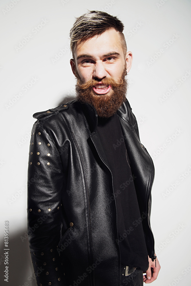 Emotional portrait of a bearded man in a leather jacket Emotional portrait of a bearded man in a leather jacket
