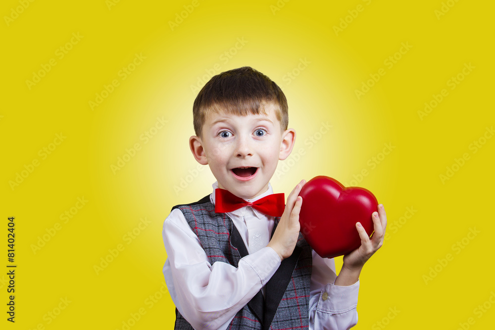 Happy, smiling little boy holding Red heart Happy, smiling little boy holding Red heart