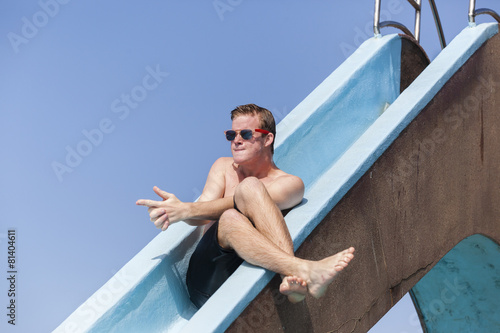 Boy Pool Slide Playing © ChrisVanLennepPhoto