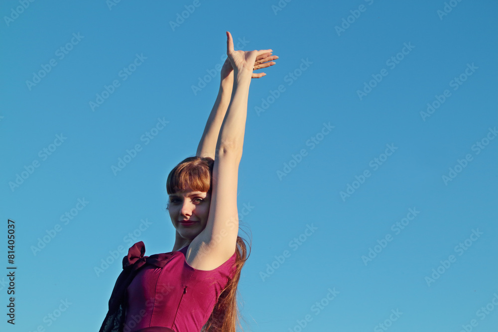 Beautiful smiling young woman in pink dress posing Beautiful smiling young woman in pink dress posing