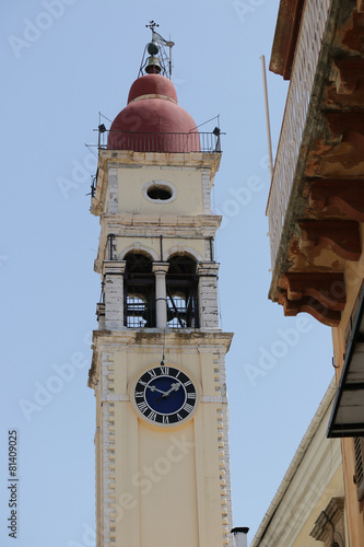 Yellow the town hall with clock in Kerkyra. Corfu. Greece. photo