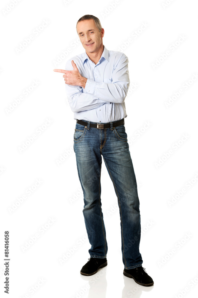 Handsome man pointing to the left Handsome man pointing to the left