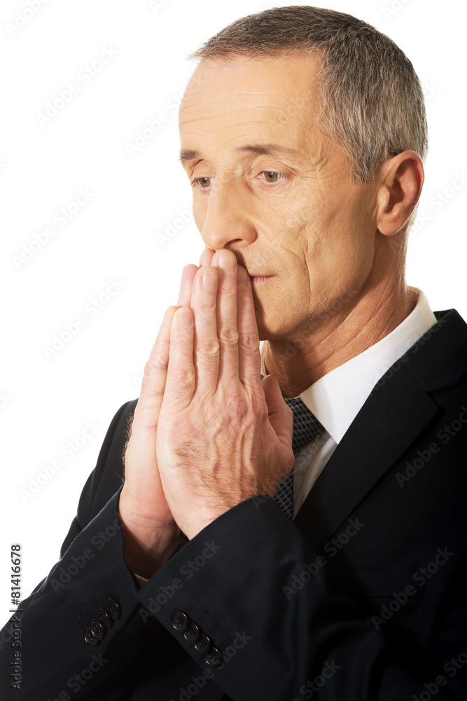 Portrait of businessman with clenched hands Portrait of businessman with clenched hands