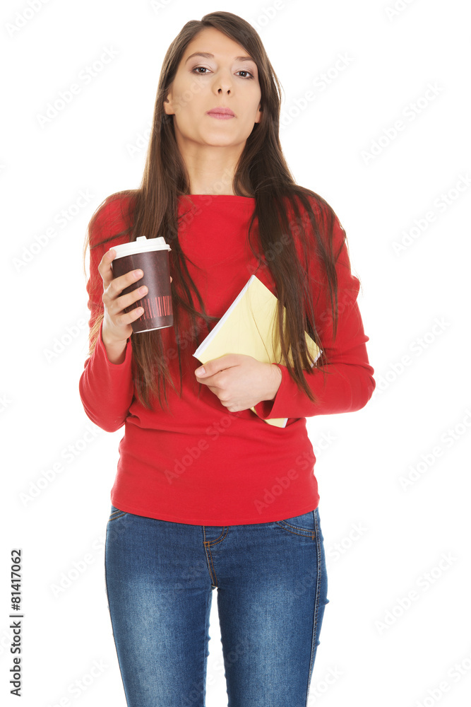 Young woman with coffee and notebook. Young woman with coffee and notebook.