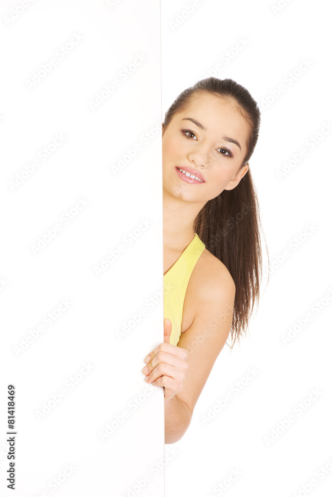 Fitness woman with empty placard. Fitness woman with empty placard.