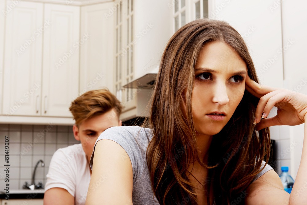 Fototapeta premium Couple having an argument in the kitchen.