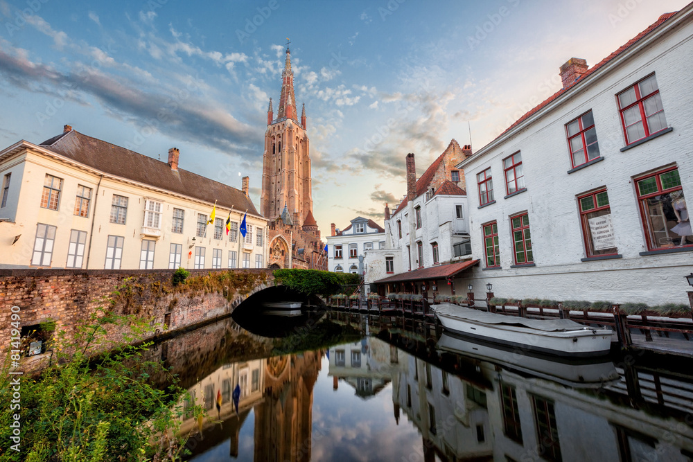 little dock and bridge in a canal of Bruges, Belgium