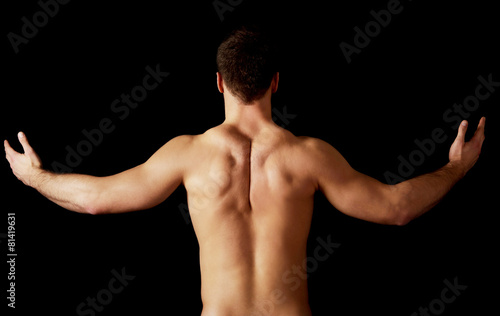 Sexy muscular man showing his muscular back.