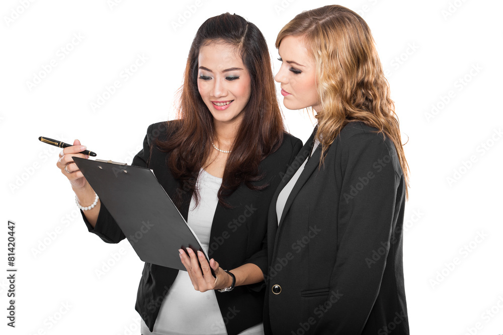 two young businesswoman wtih a clipboard, isolated two young businesswoman wtih a clipboard, isolated