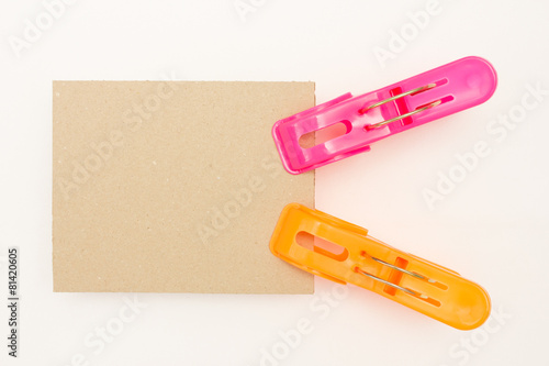 Cardboard with Pink and Orange Clothes Pins