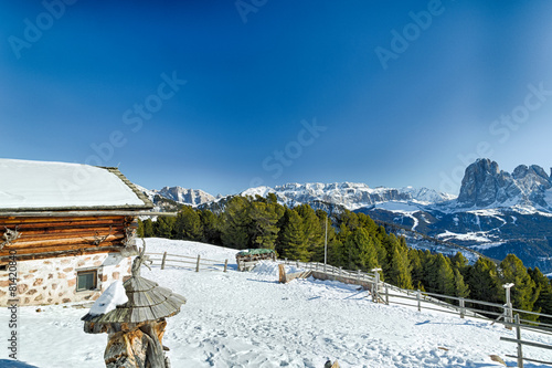 Wallpaper Mural High-altitude mountain hut in front of a panorama of snow-capped Torontodigital.ca