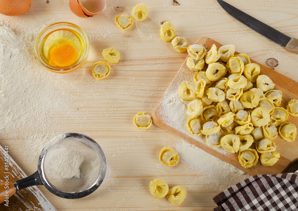 Uncooked italian Ravioli on a wooden board. Uncooked italian Ravioli on a wooden board.