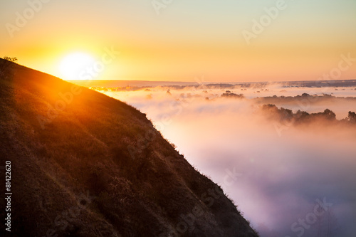 Misty dawn from hill over Valley and the forest